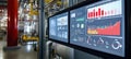 Industrial control system interface showing data analytics and process monitoring screens display Royalty Free Stock Photo
