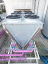 Biogas powerplant cooler.  Pink and blue pipes, flangess Royalty Free Stock Photo