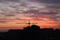 Industrial crane for construction building with sunset background. Construction crane on a background of red sky. Red morning Royalty Free Stock Photo