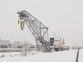 Industrial crane and ship in the harbor of Montreal in winter