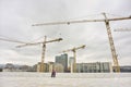 Industrial cranes building Oslo city background