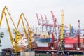 Industrial cranes and cargo ships in Marine Trade Port Royalty Free Stock Photo