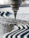 Industrial 3d printing machine extruding layers of cement material to create a detailed textured structure with precision and Royalty Free Stock Photo