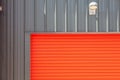 Industrial design. Bright red metal warehouse building roller sh