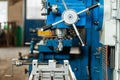 Industrial drilling machine in metal workshop - close up