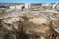 Industrial earthworks loader bucket machines on building construction site. Shot from above