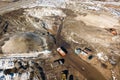 Industrial earthworks loader bucket machines on building construction site. Shot from above