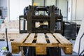 Industrial electric forklift, empty Epal pallet for loading the material Royalty Free Stock Photo