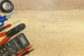 Electrician tools, components and instruments on a wooden background