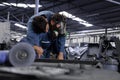 Industrial engineer carrying on back colleagues while chemical spills in the heavy Industry manufacturing factory,