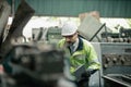 The Maintenance looking of working at industrial machinery and check security system setup Royalty Free Stock Photo