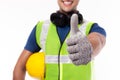 Industrial engineer man ready to work by give thumb up. Worker man hold hardhat, reflective vest. Handsome industry engineer guy