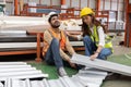 Industrial Engineer Worker Getting His Knee Injured From Metal Sheet With His Friend Helping Him