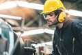 Industrial Engineers in Hard Hats.Work at the Heavy Industry Manufacturing Factory.industrial worker indoors in factory. man Royalty Free Stock Photo