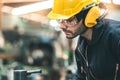 Industrial Engineers in Hard Hats.Work at the Heavy Industry Manufacturing Factory.industrial worker indoors in factory. man Royalty Free Stock Photo