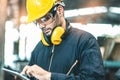 Industrial Engineers in Hard Hats.Work at the Heavy Industry Manufacturing Factory.industrial worker indoors in factory. man Royalty Free Stock Photo