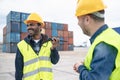 Industrial engineers working in logistic terminal of container cargo