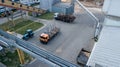 Industrial enterprise top view, truck and tractor