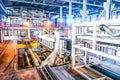 Industrial equipment at the factory in large production hall