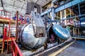 Industrial equipment at the factory in large production hall