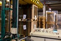 Industrial equipment - typical stretch wrapping machine in process of work. Packaging of corrugated cardboard. Selective focus