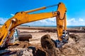 Industrial excavator bulldozer digging in sandpit Royalty Free Stock Photo