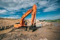 excavator in dirt, working on highway construction and building foundation Royalty Free Stock Photo