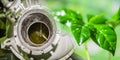 Industrial factory chimneys on background of green plants .