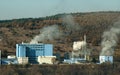 Industrial factory with chimneys and smoke