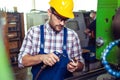 Industrial factory employee working in metal manufacturing industry. Royalty Free Stock Photo