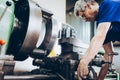 Industrial factory employee working in metal manufacturing industry