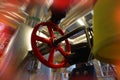 Industrial factory worker turning red wheel of valve Royalty Free Stock Photo