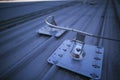 industrial fall arrest fixed safety line roof anchor point corner systems on top of construction Royalty Free Stock Photo