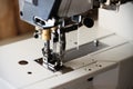 Industrial flat-seam sewing machine. Soft focus