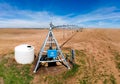 Industrial Grade Field Sprinkler in Fresh Dirt Field