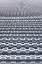 Industrial grid wall metallic construction perspective surface with holes soft focus vertical background close up picture concept