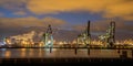 Industrial Harbor quay with loading cranes at night Royalty Free Stock Photo