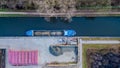 Industrial Harmony: Cargo Ship Docked at Riverside Depot