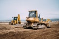 Industrial heavy duty machinery, details of excavator and engineer building highway Royalty Free Stock Photo