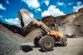 Industrial heavy duty wheel loader working on construction site. Industrial machinery loading Royalty Free Stock Photo