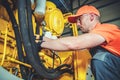 Industrial Heavy Equipment Mechanic at Work Royalty Free Stock Photo