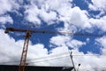 Industrial industrial construction cranes getting ready to work. Royalty Free Stock Photo