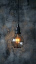 Industrial innovation hanging lightbulb on textured cement backdrop