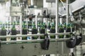 Industrial interior of beverage plant production. Conveyor belt, filled plastic bottles on factory, industry production Royalty Free Stock Photo