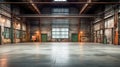 Industrial interior of an old factory or warehouse. Empty warehouse with light coming through openings Royalty Free Stock Photo