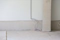 Industrial interior preparation with concrete wall and electrical wiring Royalty Free Stock Photo