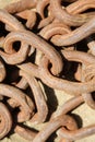 Iron Chain. Iron Chains in a pile on the ground with rust and dirt Royalty Free Stock Photo