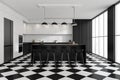 Industrial kitchen with chequered floor tiles