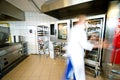 Industrial kitchen interior with busy cooks Royalty Free Stock Photo
