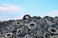 Industrial landfill for the processing of waste tires and rubber tyres. Pile of old tires and wheels for rubber recycling. Tyre Royalty Free Stock Photo